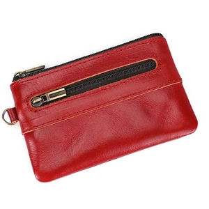 Detail view of red crazy horse leather coin purse with metal zipper and front pocket