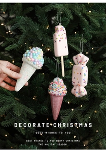 Detail of Christmas tree ice cream and candy pendants with pink glitter and foam texture