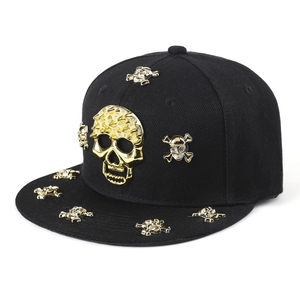 Hip hop snapback hat featuring a 3D gold metal skull emblem and decorative flat brim studs