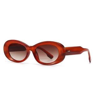 Modern vintage oversized oval tortoiseshell sunglasses for women with brown gradient lenses