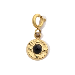 Detail of a vintage gold-plated pendant with a black bead and a spring ring clasp