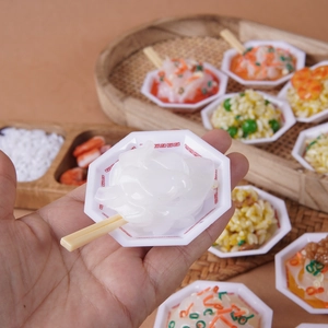 Miniature realistic food keychain with Chinese noodles and rice in an octagonal plate
