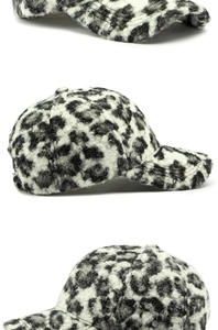 Detail view of leopard print baseball cap showing thick faux shearling texture and seams