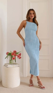 Macro shot of light blue sleeveless dress showing textured water ripple pleated fabric