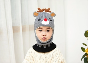 Detail of grey knitted deer hat with brown antlers and red nose for toddlers