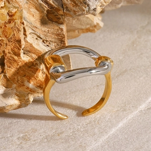 Modern two-tone 18k gold plated stainless steel D-letter open ring on natural stone