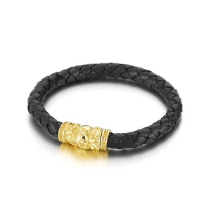 Braided black leather bracelet with a gold-tone stainless steel magnetic skull clasp