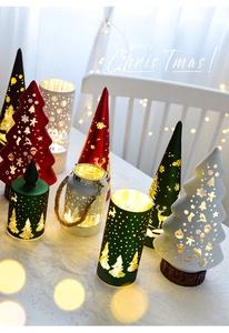 Detail of Christmas tree lantern with reindeer hollow design and warm glowing light