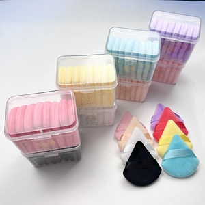 Set of soft velvet triangle powder puffs in multiple colors for makeup application