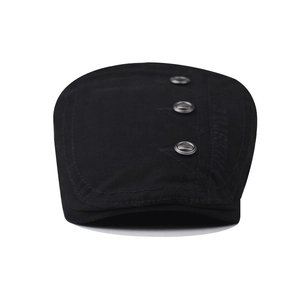 Black cotton beret cap with metal fashion buttons and freestyle embroidery on white background