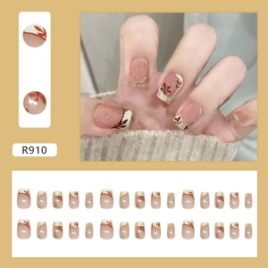 French cream press-on nails with red maple leaf patterns and elegant gold edges