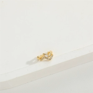 Minimalist gold V-shaped double-layer ear cuff with sparkling zircon accents on white base
