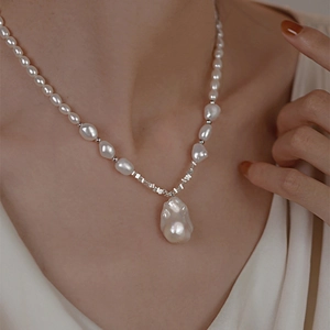 Close-up of French baroque pearl necklace showing the elegant droplet pendant and beads