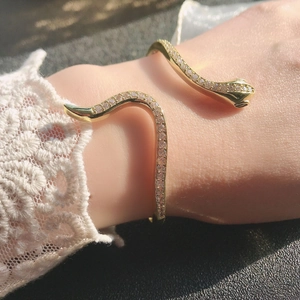 Elegant gold snake-shaped open bracelet with micro-pave crystals and vintage design