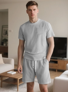 Detail shot of men's summer waffle knit two-piece set with pocket and drawstring waist
