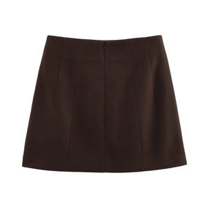 Detailed view of dark brown high-waisted wool mini skirt with sharp tailored cut