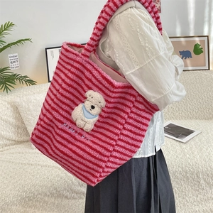 Detail of pink striped plush tote bag with a cute white dog patch and HAPPY DOG embroidery