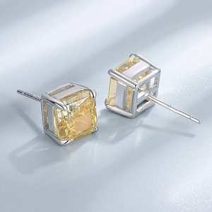 Detail view of square cut yellow gemstone earrings in S925 sterling silver four-prong setting