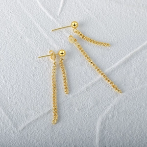 Close-up of S925 silver ball stud earring with long chain tassel in gold finish