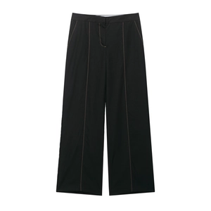 Black high-waist straight leg trousers with vibrant yellow contrast stitching detail