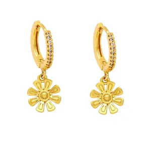 Polished gold flower drop earrings with sparkling white crystals on minimalist hoops
