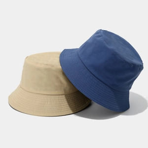 Quick-dry breathable reversible bucket hats in beige and navy blue for sun protection
