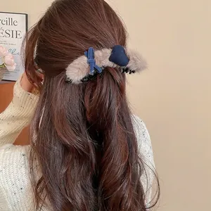 Brown faux fur heart hair claw clip with blue velvet bow for elegant women hairstyles