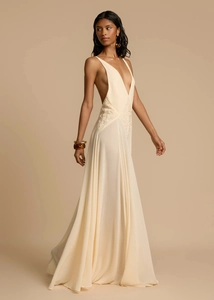 Detail of elegant V-neck lace patchwork and waist design on a beige summer maxi dress