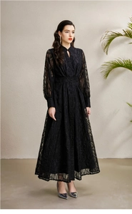 Detail view of V-neck hollow lace dress with floral texture and long lantern sleeves