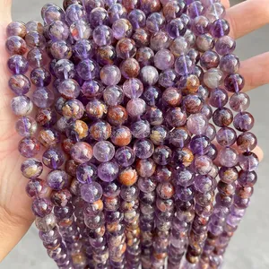 Macro detail of natural Super Seven crystal beads with rich mineral inclusions and luster
