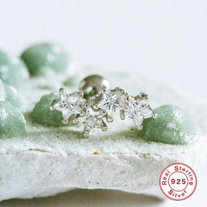 Detailed macro view of S925 sterling silver ear stud with five star-shaped zircon stones