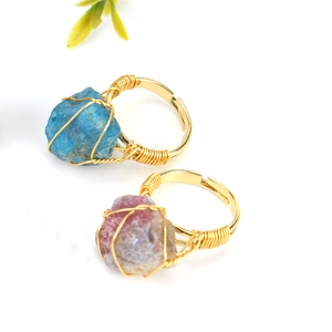 Handmade gold wire-wrapped adjustable rings with raw blue and purple natural stone