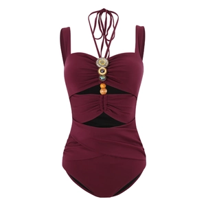 Detail of burgundy one-piece swimsuit with bohemian beads and waist cut-out design