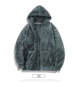 Macro detail of dark grey fleece hoodie showing thick texture and zipper closure