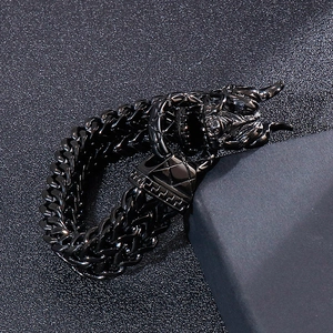 Detailed view of black dragon head clasp on double-row curb chain punk bracelet