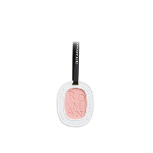 Oval scented wax tablet with pink core and black ribbon hanger for home decor