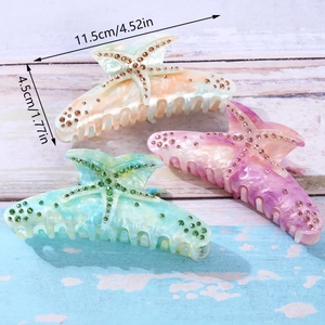 Detailed view of rhinestone starfish hair claws with size dimensions 11.5cm by 4.5cm