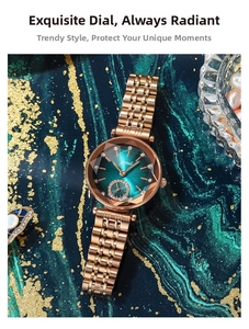 Detail of rose gold ladies watch with emerald green sunray dial and faceted glass cover