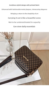 Detailed view of brown monogram crossbody bag with golden metal logo and textured strap