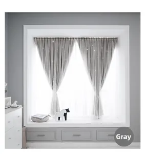 Detail of grey blackout curtain with sheer layer and star hollow cutouts on window