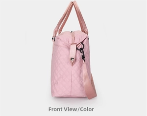 Side view of pink quilted yoga bag showing padded handles and durable metal hooks