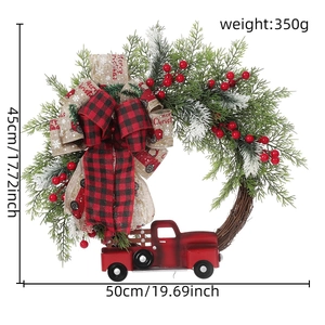 Detail of Christmas wreath with red truck, pine needles, and Merry Christmas plaid ribbon