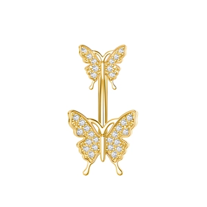 Detailed view of golden belly button ring featuring two sparkling crystal butterflies