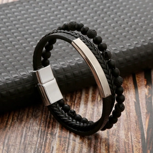 Detail of double-layer men's bracelet with black woven leather and matte stone beads