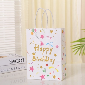 White paper birthday gift bag featuring colorful balloons and golden Happy Birthday text