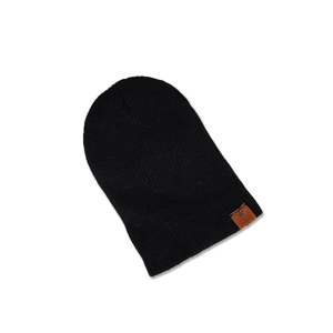 Close-up of black ribbed knit beanie featuring a brown leather SUPER STAR star patch