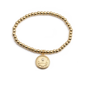 Golden beaded bracelet with a circular beetle scarab pendant and sparkling white zircon stone