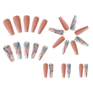 Detail of long coffin press-on nails with nude pink and marble gold foil art design