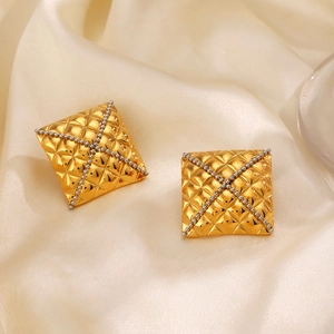 Square gold geometric earrings with quilted pattern and cross bead design on silk
