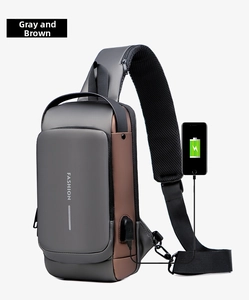 Men's crossbody bag featuring integrated USB charging port for smartphones and devices